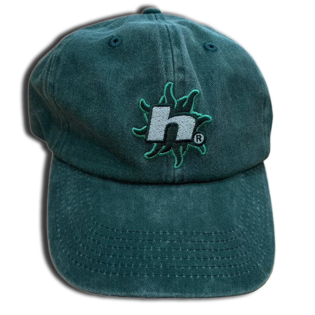 Green cap with a logo on a white background