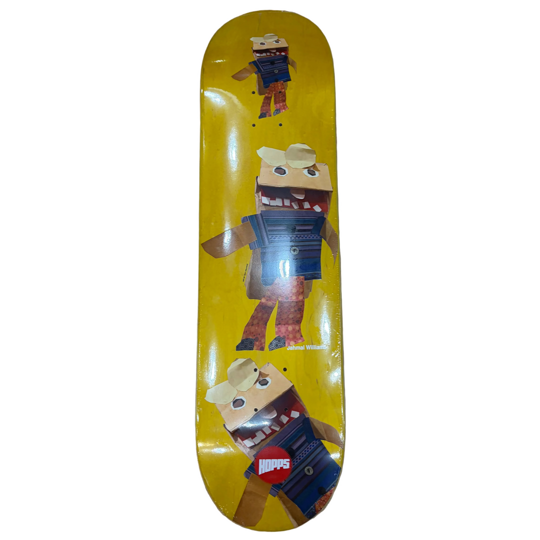 Skateboard deck with cartoon character design on a wooden floor
