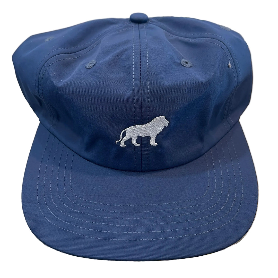 Blue bucket hat with a white logo on a textured surface