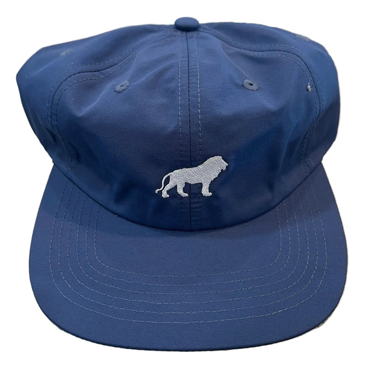 Blue bucket hat with a white logo on a textured surface
