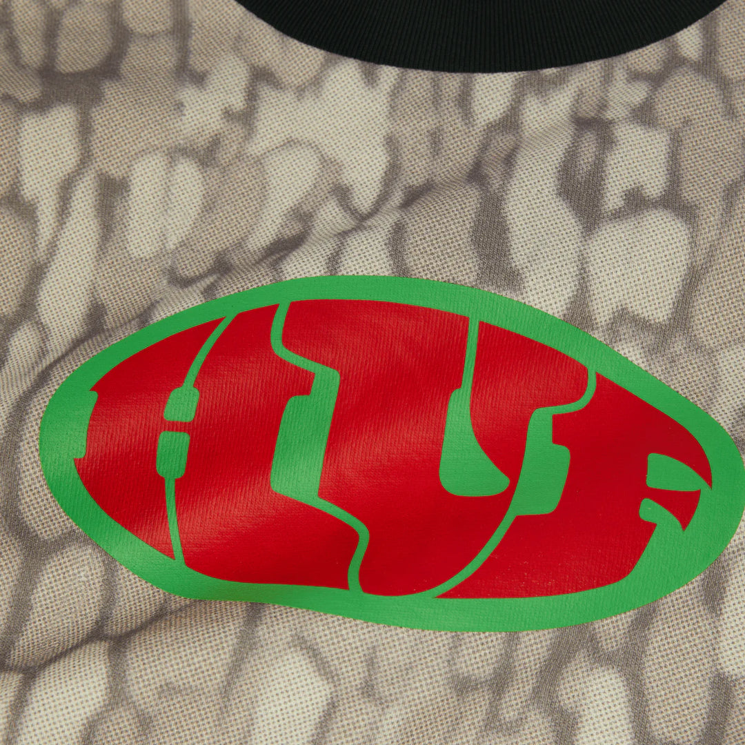 Red and green logo on a textured beige background