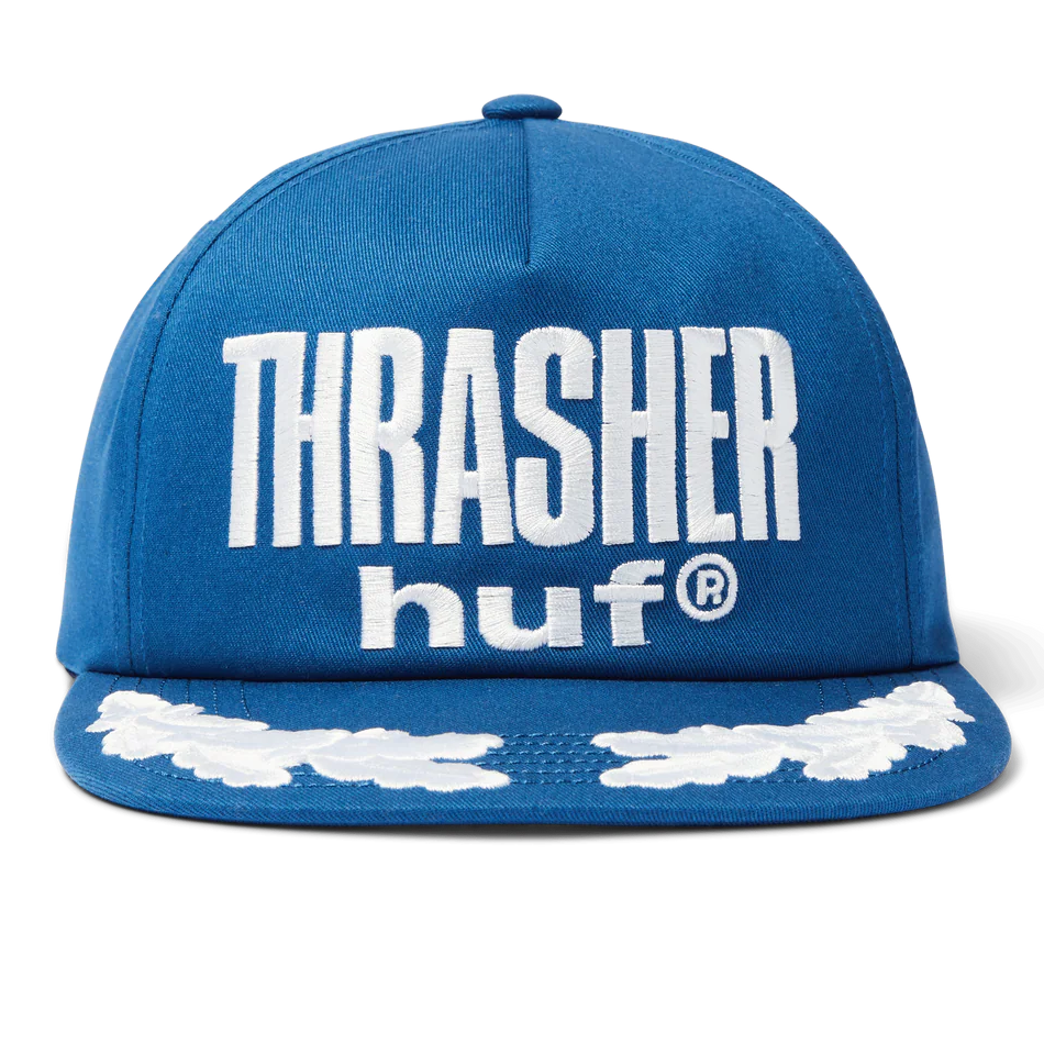 Blue cap with 'Thrasher' and 'huf' logos on a white background