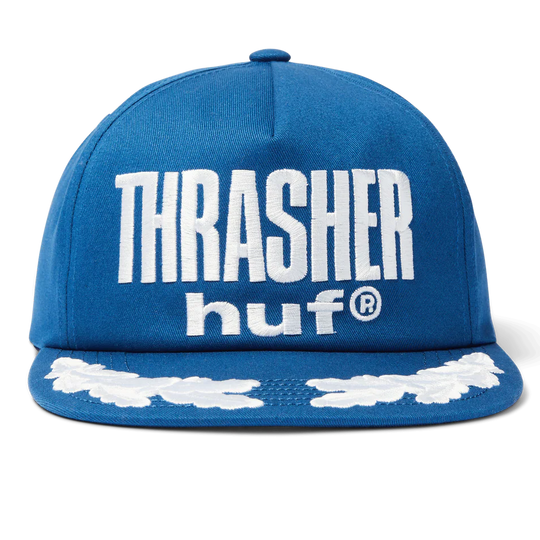 Blue cap with 'Thrasher' and 'huf' logos on a white background