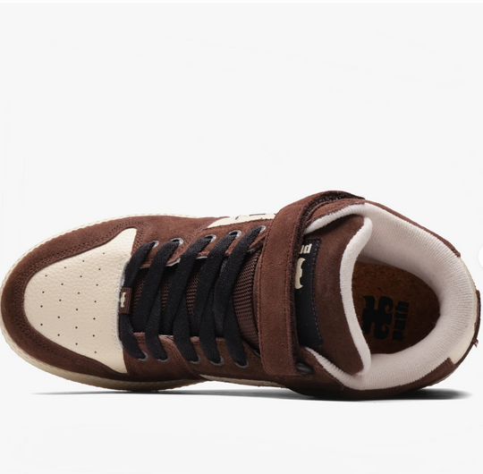 Brown and white sneaker with black laces on a white background