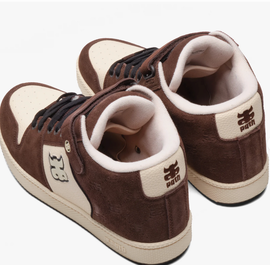 Brown and white sneakers with visible brand logos on a white background