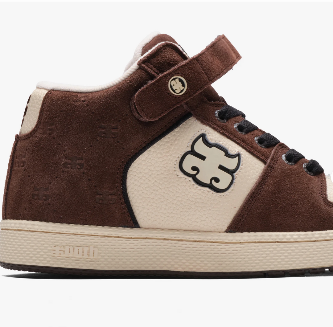 Brown and beige sneaker with a logo on a white background