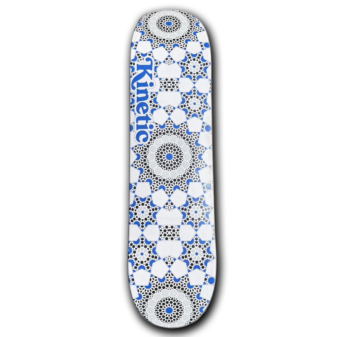 Skateboard deck with a geometric pattern and 'Kinetic' branding on a white background
