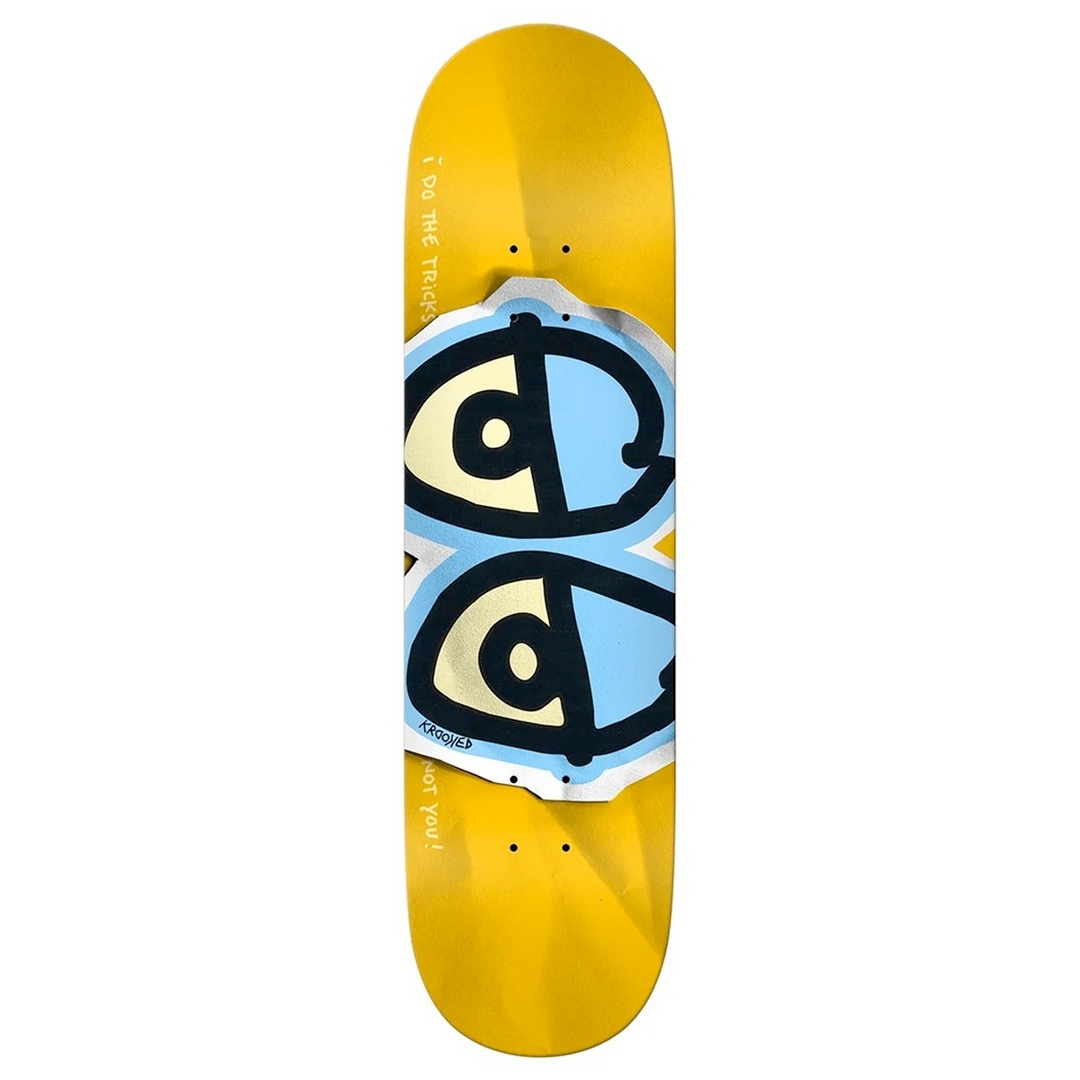 Skateboard deck with a yellow base and black, blue, and white design on a white background