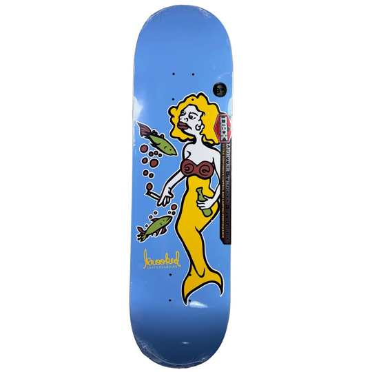 A skateboard deck with a blue gradient background featuring a retro-style illustration of a mermaid with yellow hair, a red bikini top, and green fish, shown on a plain white background.