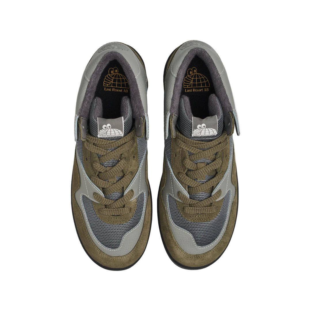 Pair of brown and gray sneakers on a white background