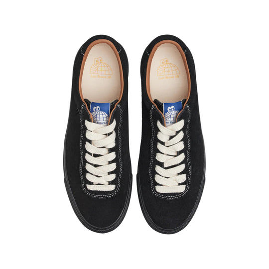 Black sneakers with white laces on a white background