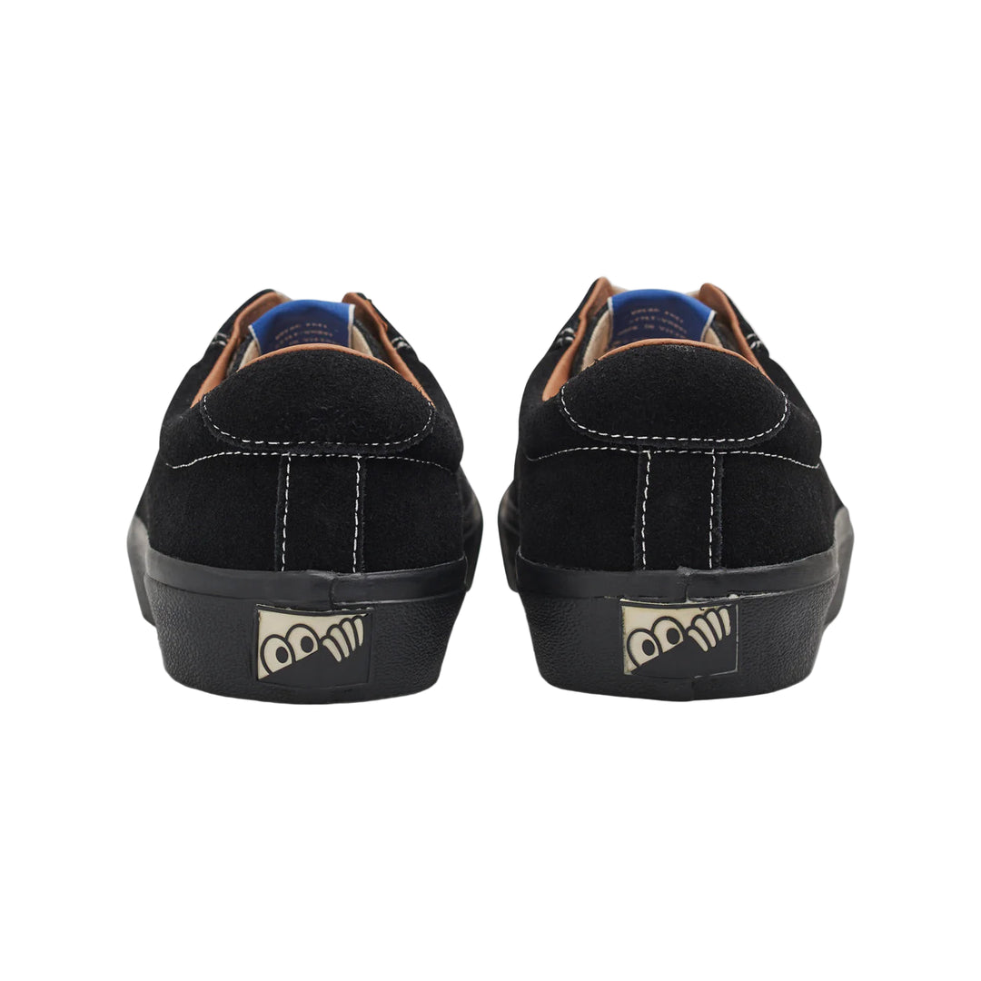 Black sneakers with a logo on the sole against a white background