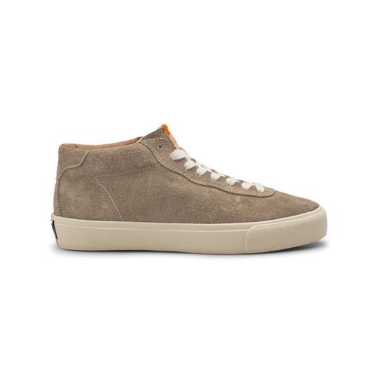 Brown suede sneaker with white laces on a white background