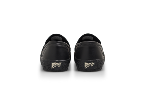 Black shoes with cartoonish eye designs on a white background