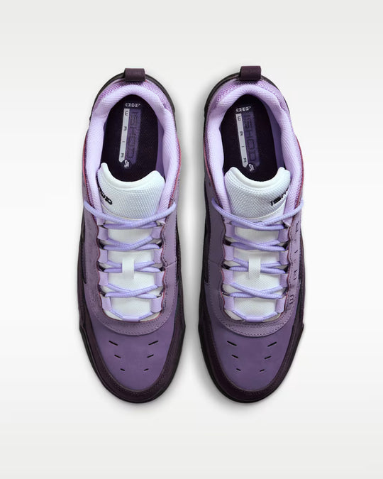 Purple and white sneakers on a light gray background