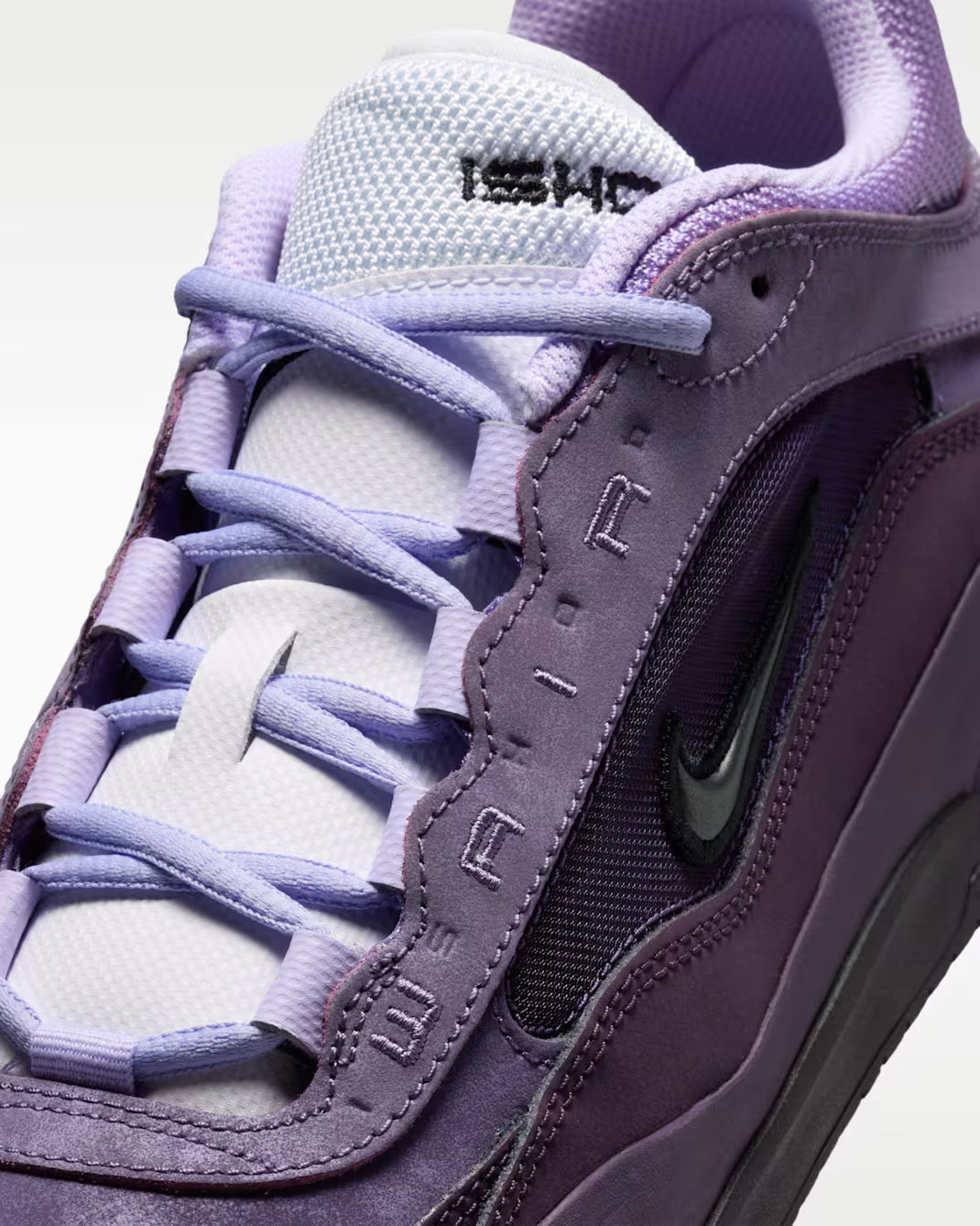 Purple sneaker with visible Nike logo on a white background