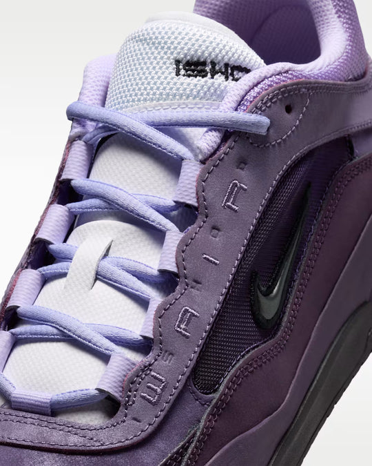 Purple sneaker with visible Nike logo on a white background