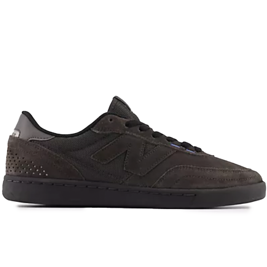 Black sneaker with reflective elements on a white background