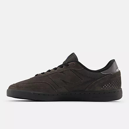 Black sneaker on a light gray background