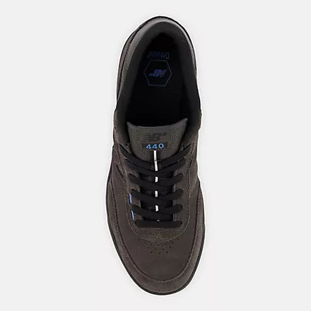 Dark gray sneaker with brand logo on a light gray background