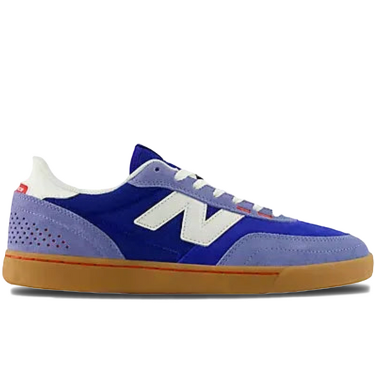 Blue and purple new balance sneaker with white accents 