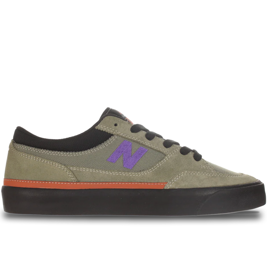 Green sneaker with purple 'N' logo on a white background