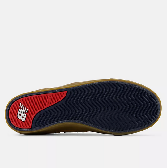 Close-up of a shoe sole with red and brown accents on a white background