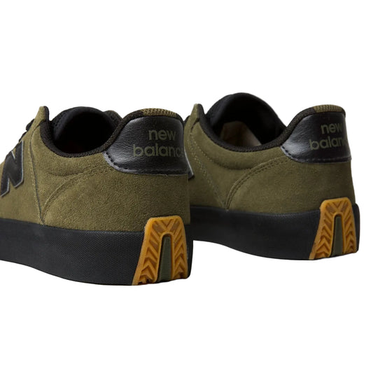New Balance 340 sneakers in olive green suede and black leather, featuring a black midsole and a distinctive yellow-brown tread detail on the heel.