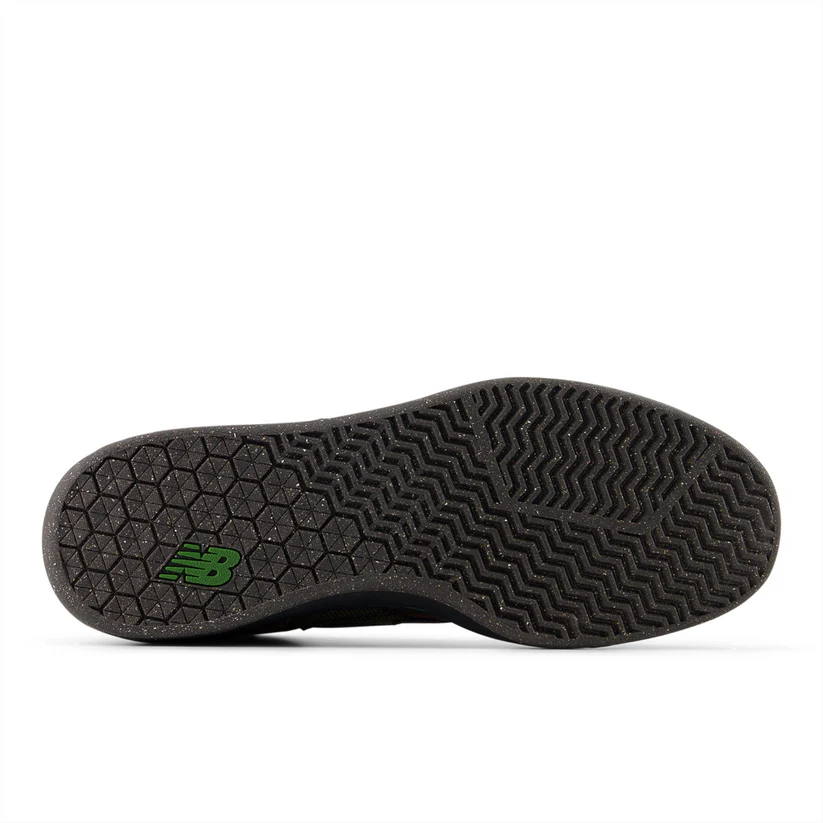 Black shoe sole with green logo on a white background