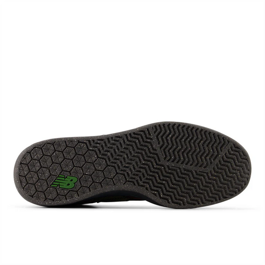 Black shoe sole with green logo on a white background