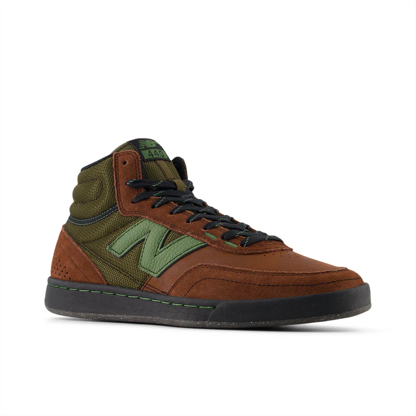 Brown and green sneaker with New Balance logo on a white background