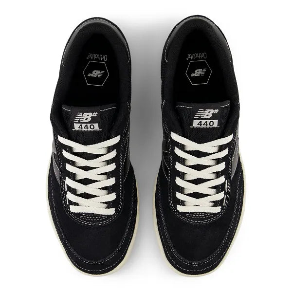 Black sneakers with white laces on a white background