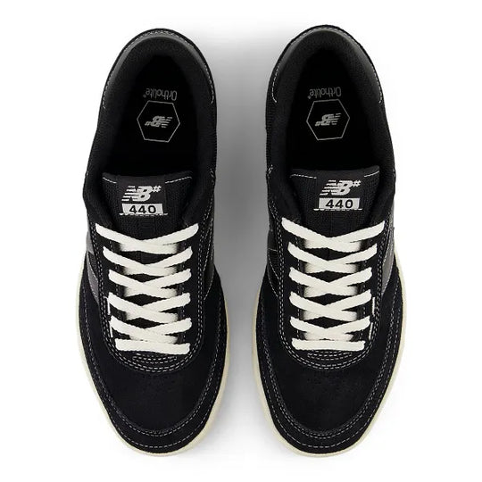 Black sneakers with white laces on a white background