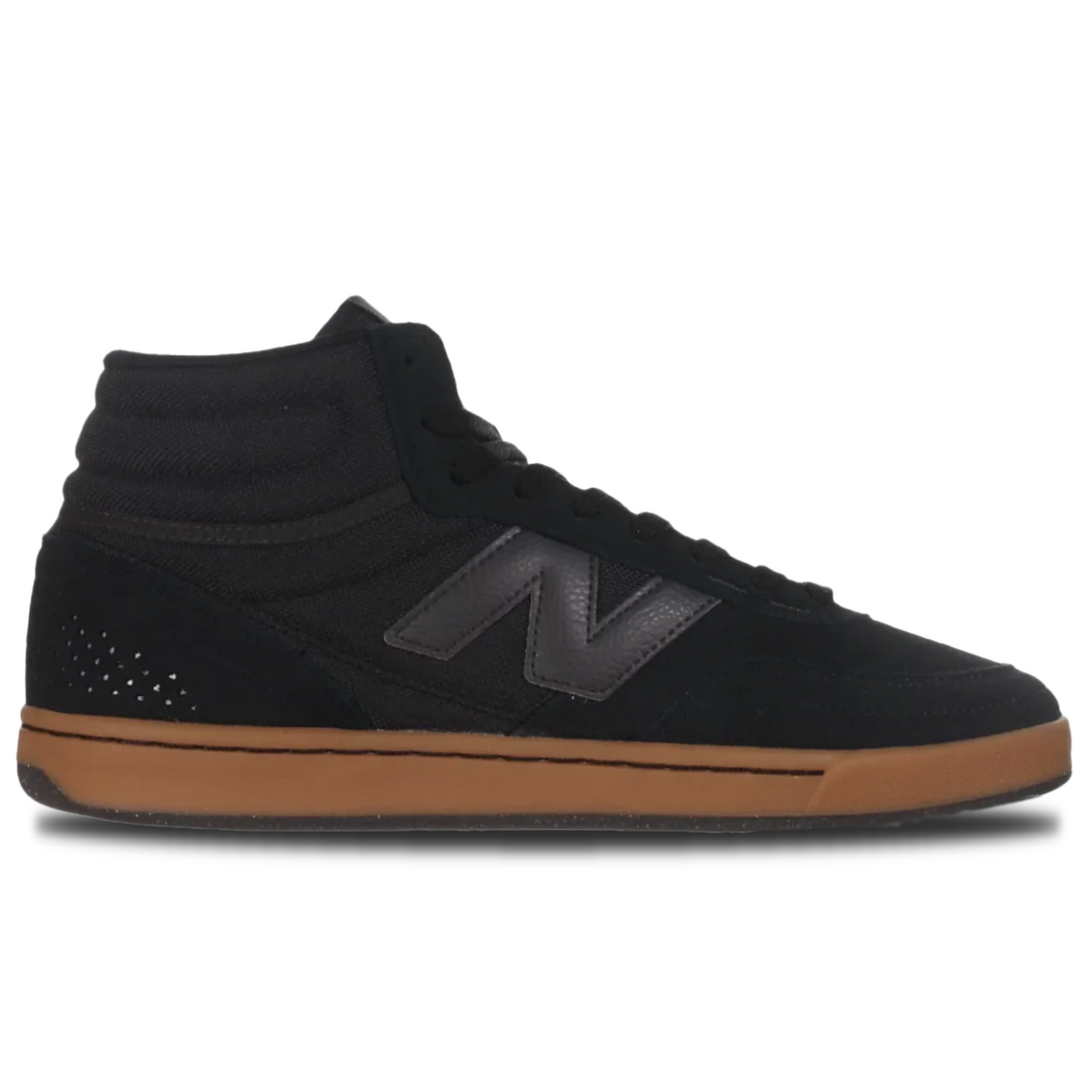 Black high-top sneaker with brown sole on a white background