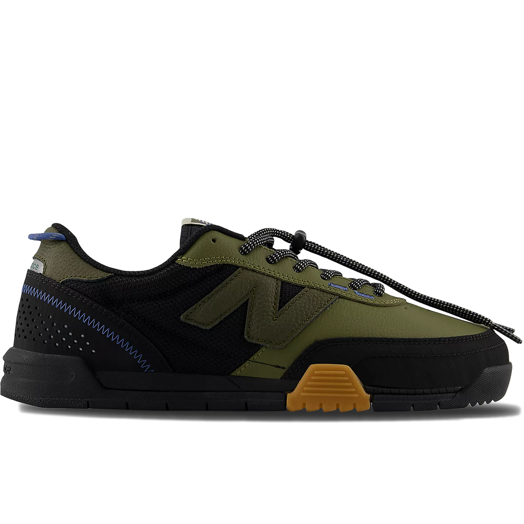 Green and black 440 sneaker with brown sole 