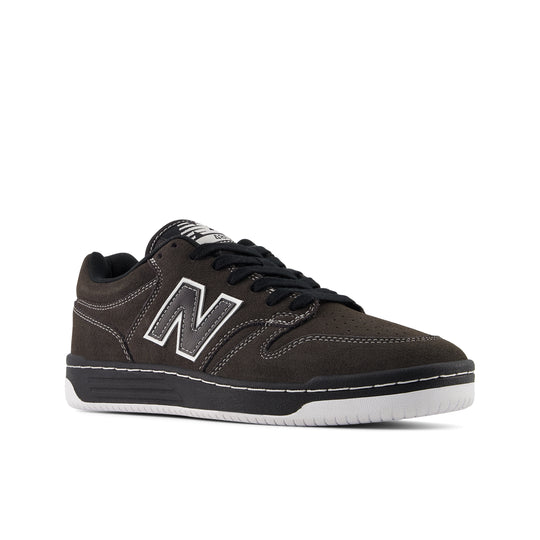 Black sneaker with New Balance logo on a white background