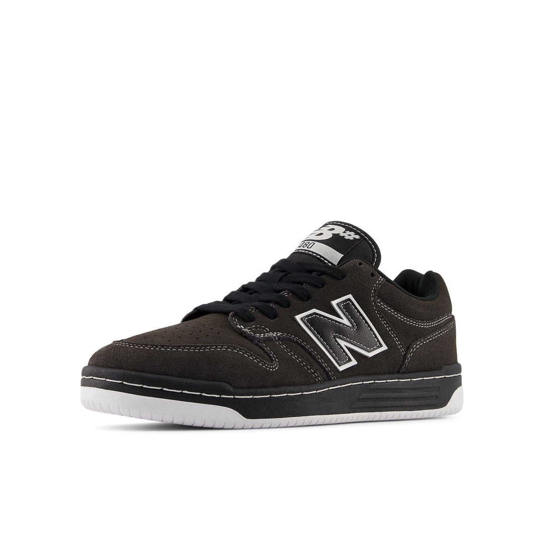 Black sneaker with a white sole on a white background