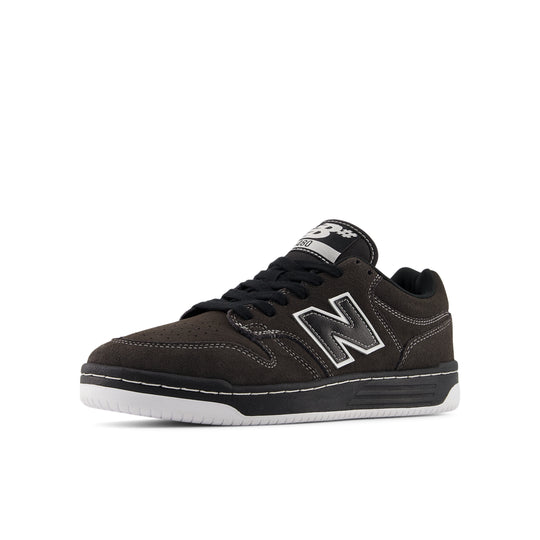 Black sneaker with a white sole on a white background