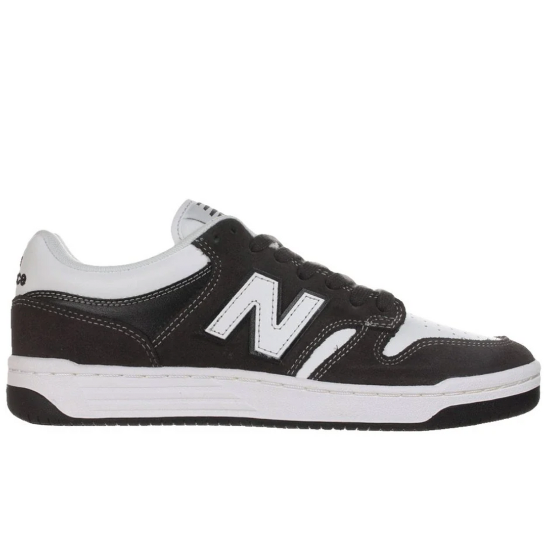 Black and white sneaker with New Balance logo on a white background