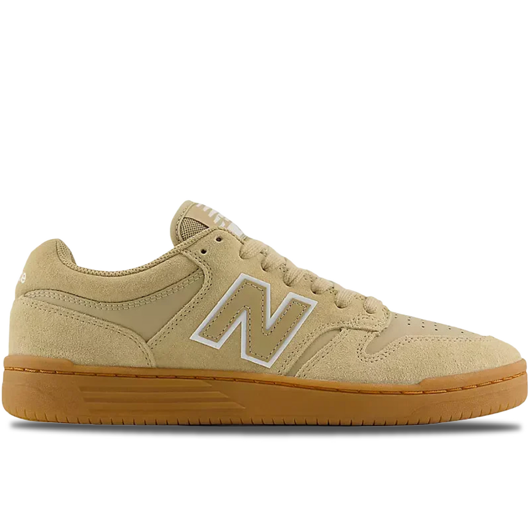Beige sneaker with brown sole on a white background