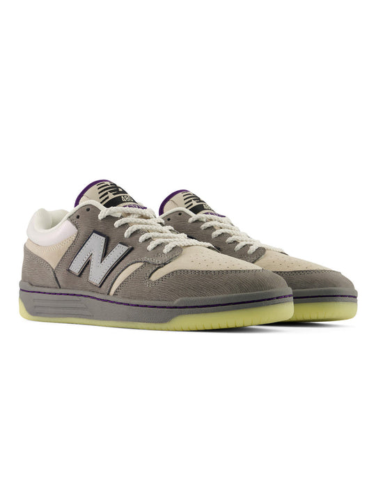 Black and purple sneakers on a white background