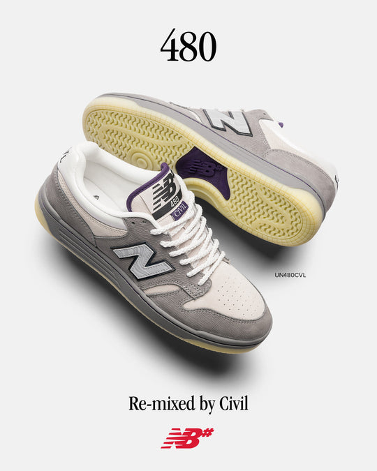 A pair of New Balance 480 sneakers in a re-mixed grey, white, and purple colorway, with the text &