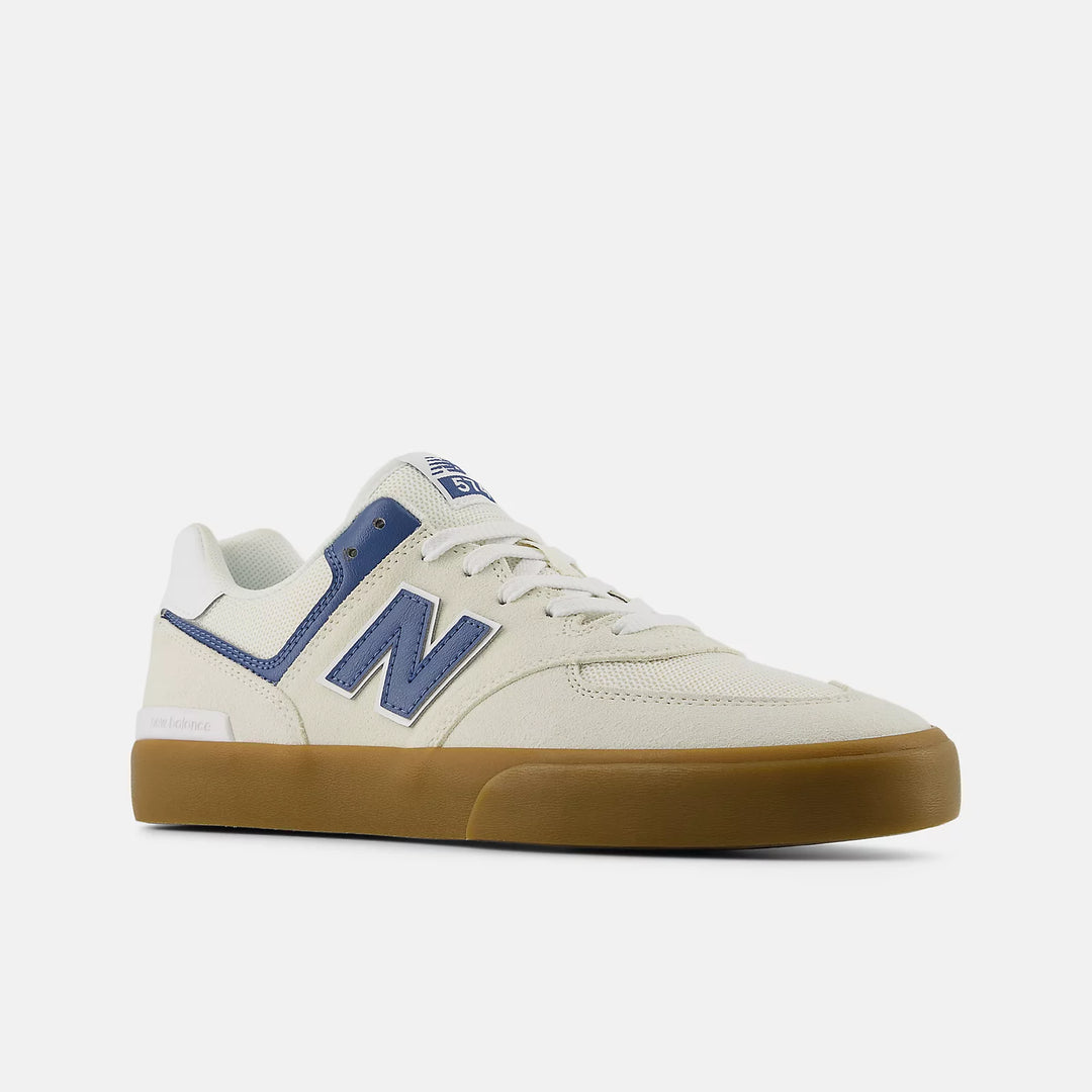 White sneaker with blue accents and brown sole on a white background