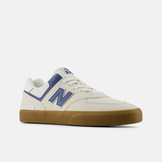 White sneaker with blue accents and brown sole on a white background