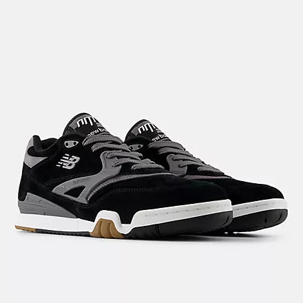 Black and gray sneaker with white sole on a light gray background