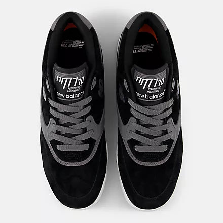 Black sneakers with gray laces on a white background