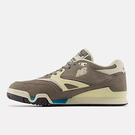 Gray sneaker with white accents on a light gray background