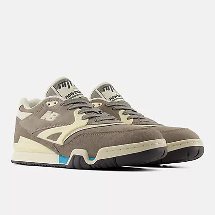 Gray sneakers with white accents on a light gray background