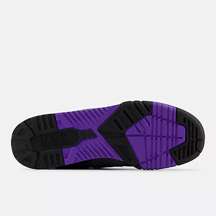Purple and black sole of a shoe on a white background
