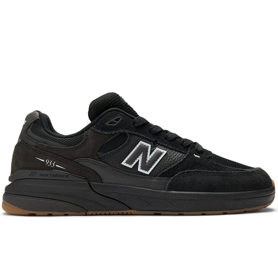Black sneaker with New Balance logo on a white background